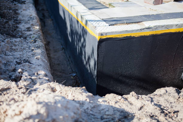 Professional Waterproofing technician working in Garden City, SC